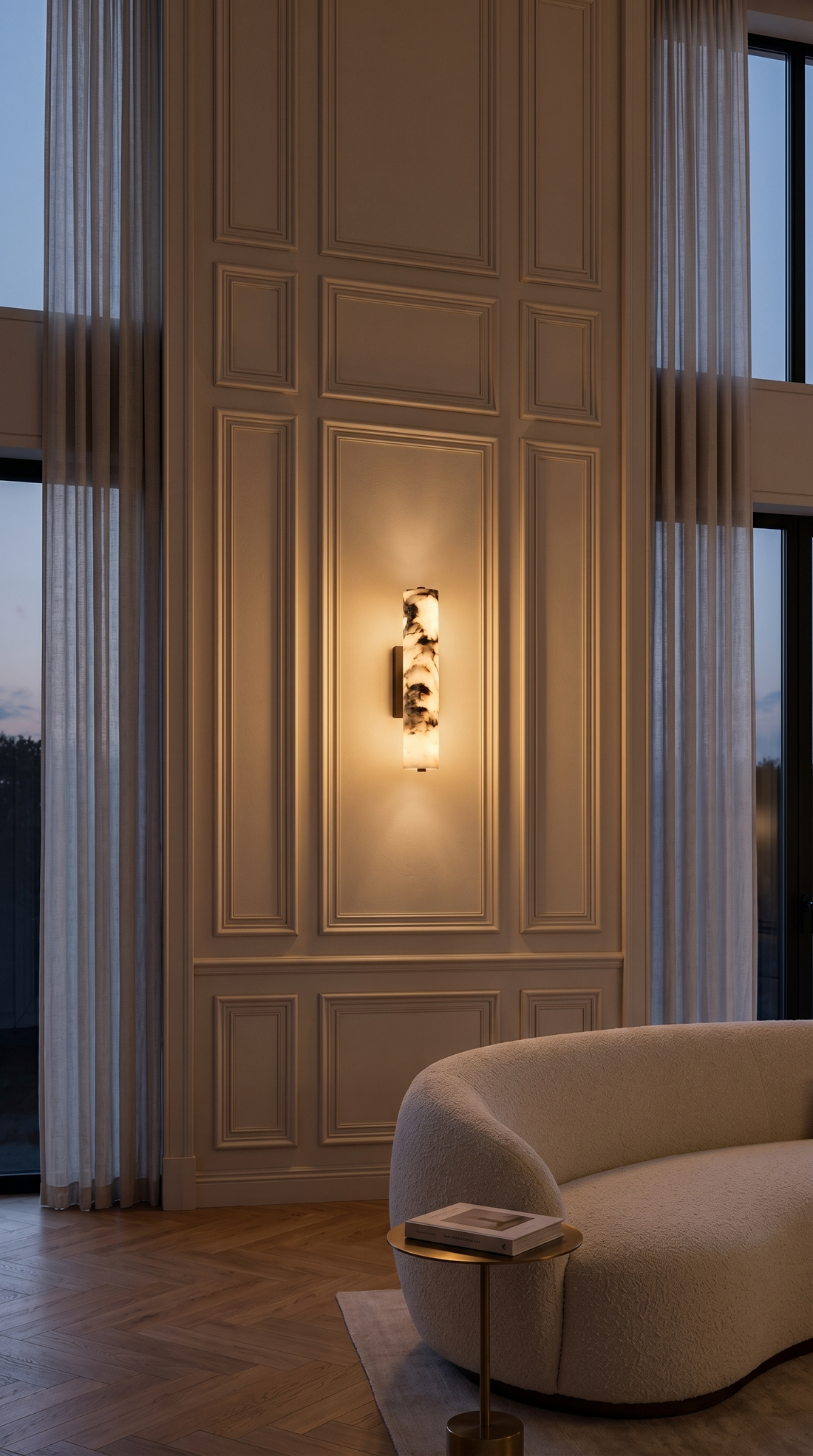 Marble wall light installed in a luxury hallway entrance space with natural stone finish and warm upward downward glow