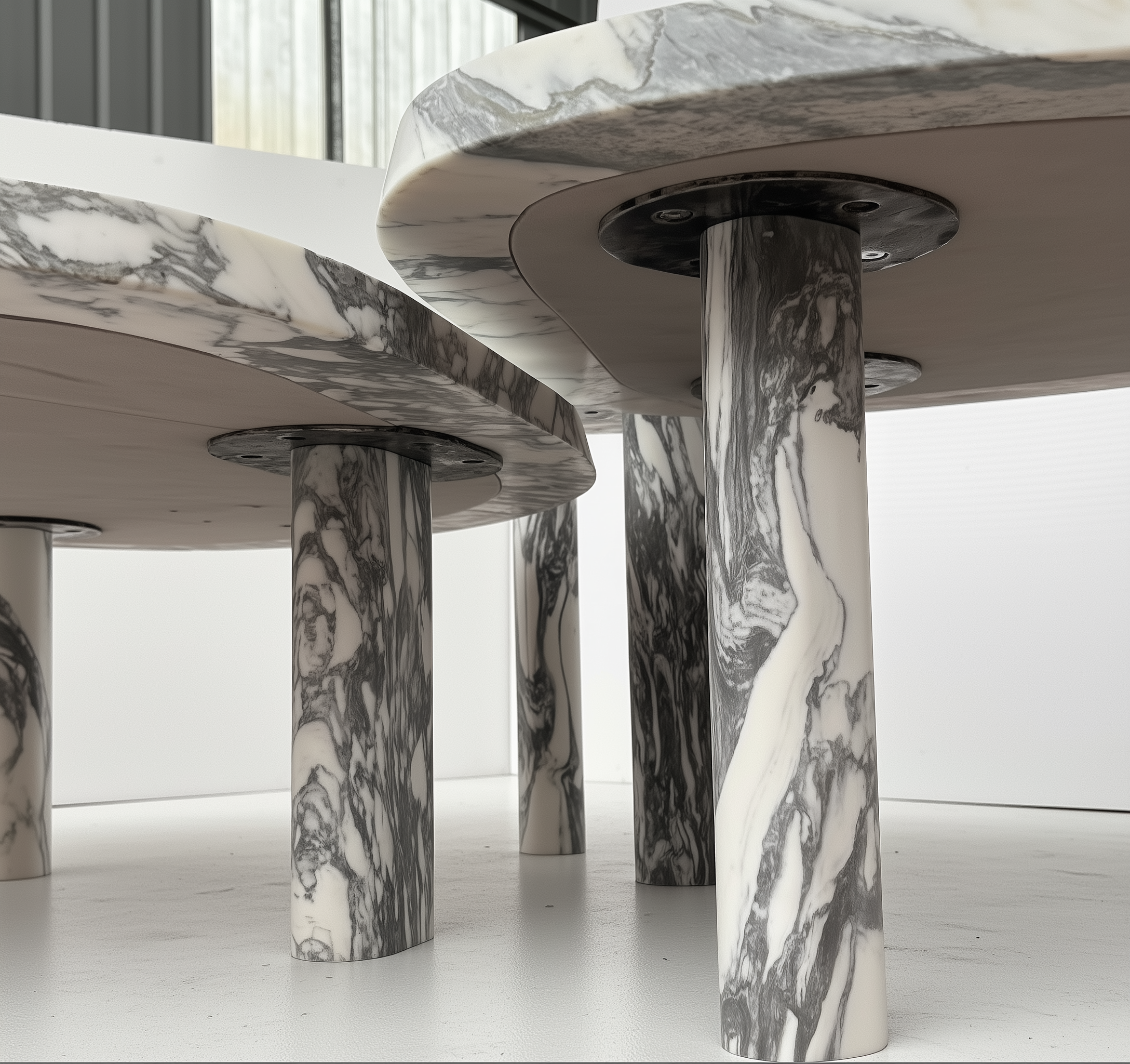 Marble-patterned cylindrical tables on a light background