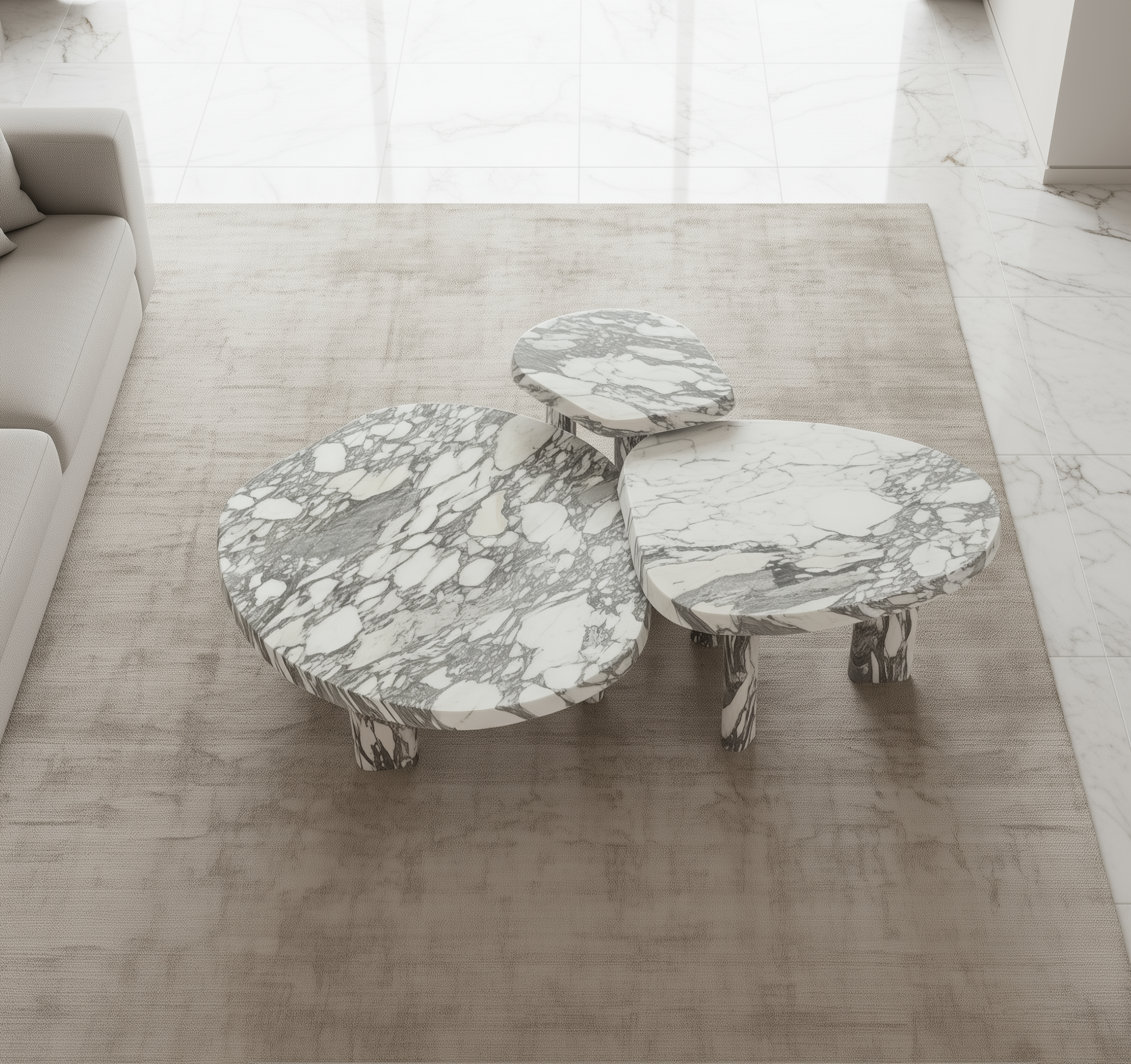 Marble-patterned coffee table set on a wooden floor with a neutral color scheme.