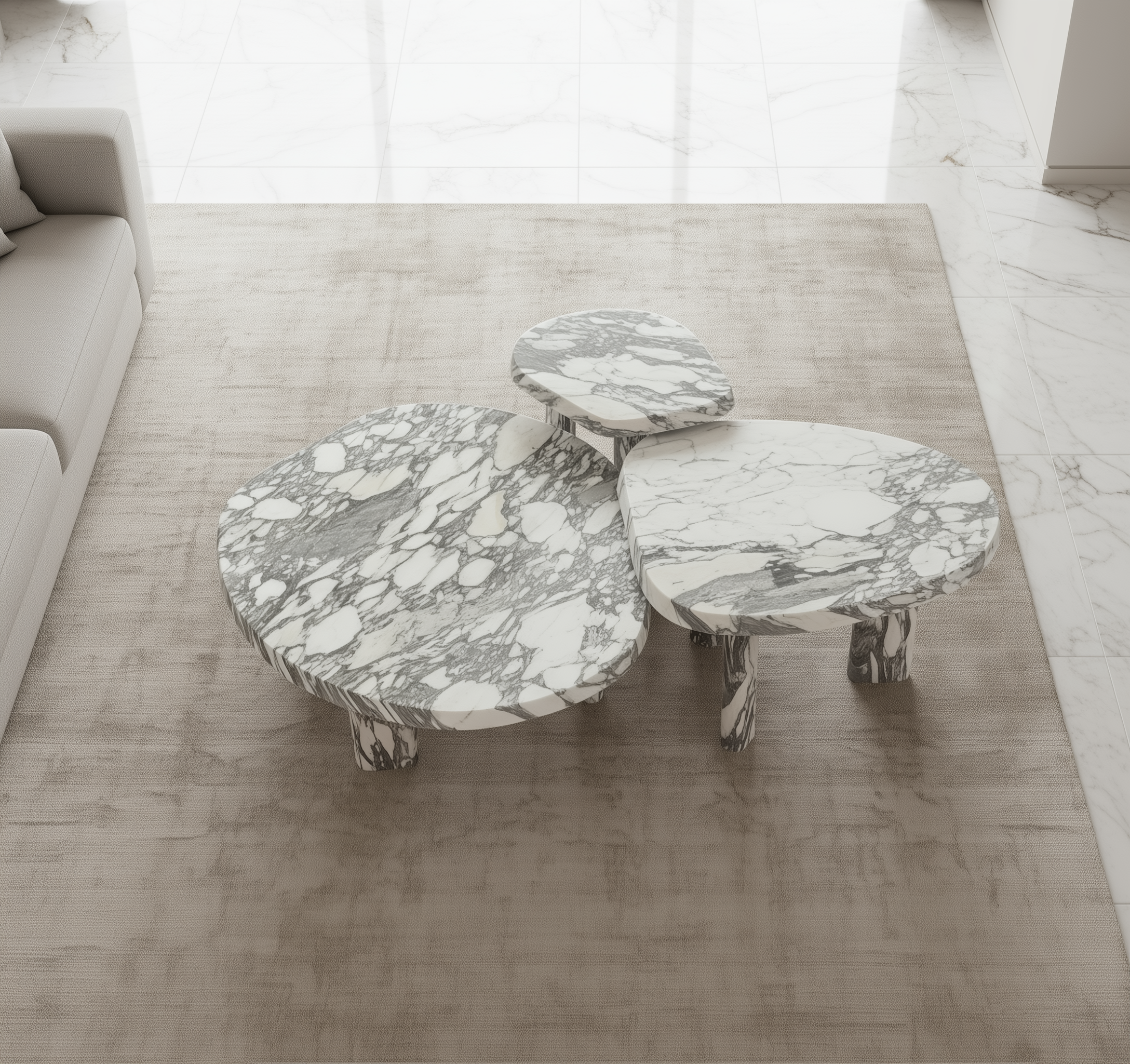 Marble-patterned coffee table set on a wooden floor with a neutral color scheme.