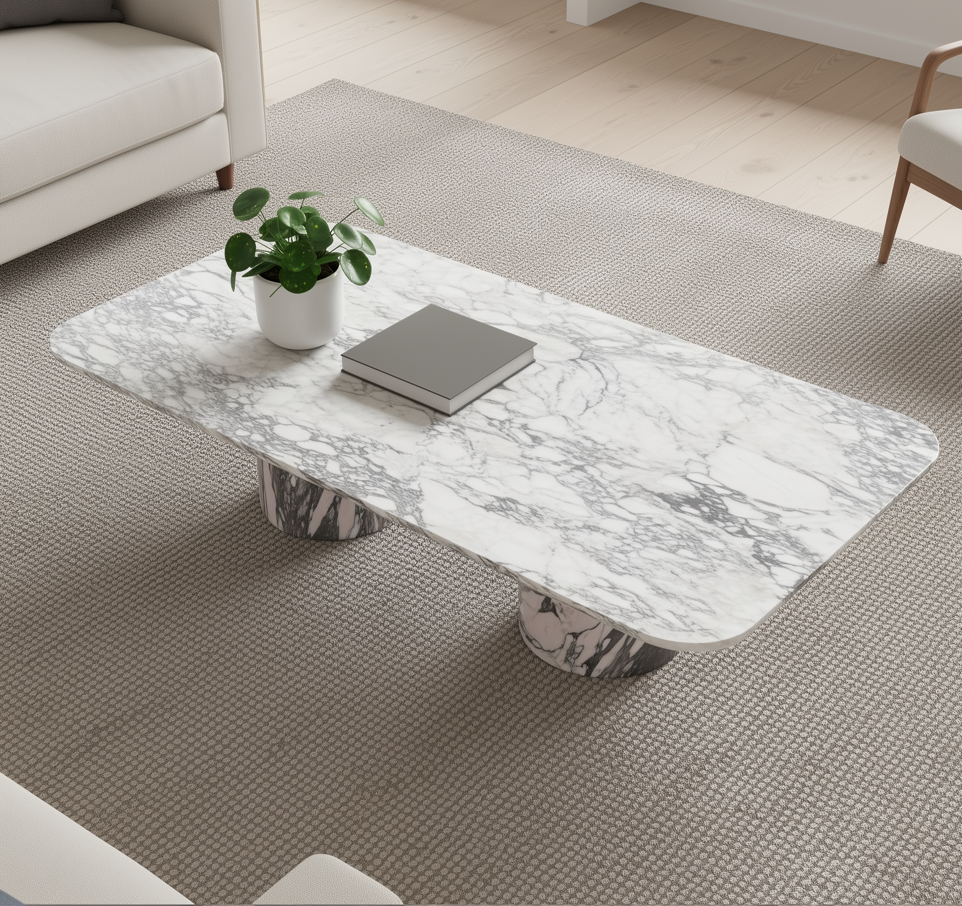 Arabescato rectangular marble coffee table  with a plant and book in a living room setting