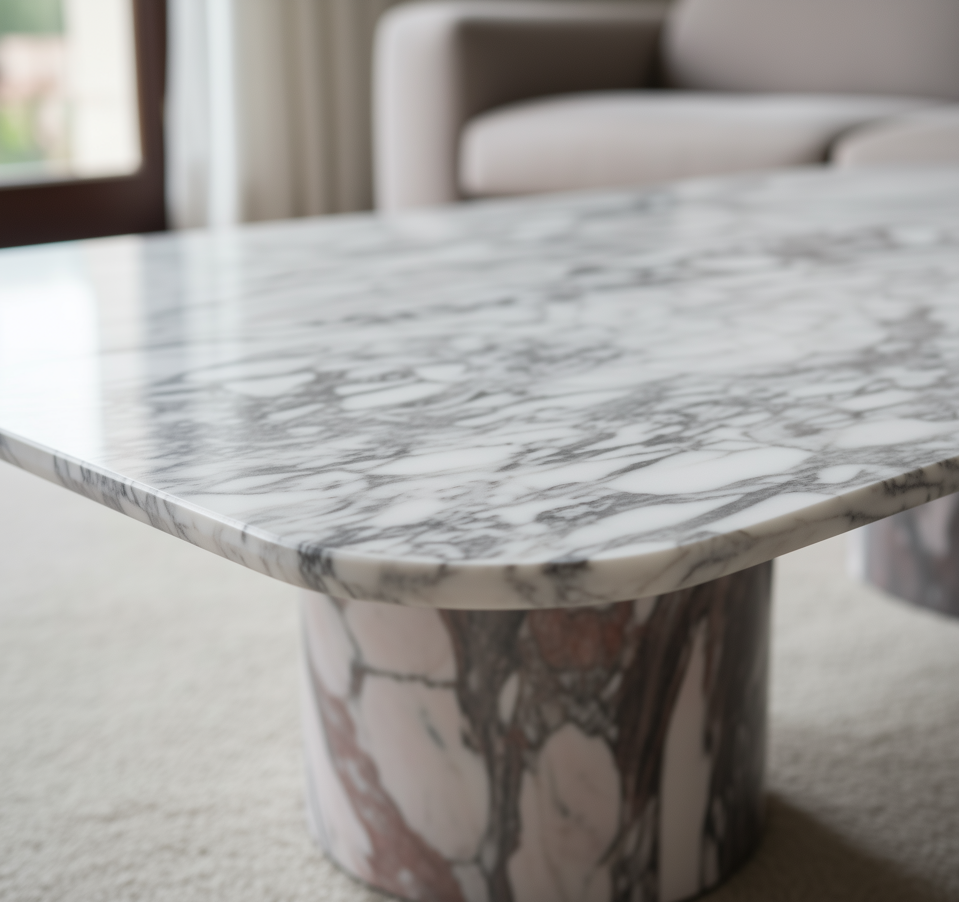 Marble-patterned table in a room with neutral decor