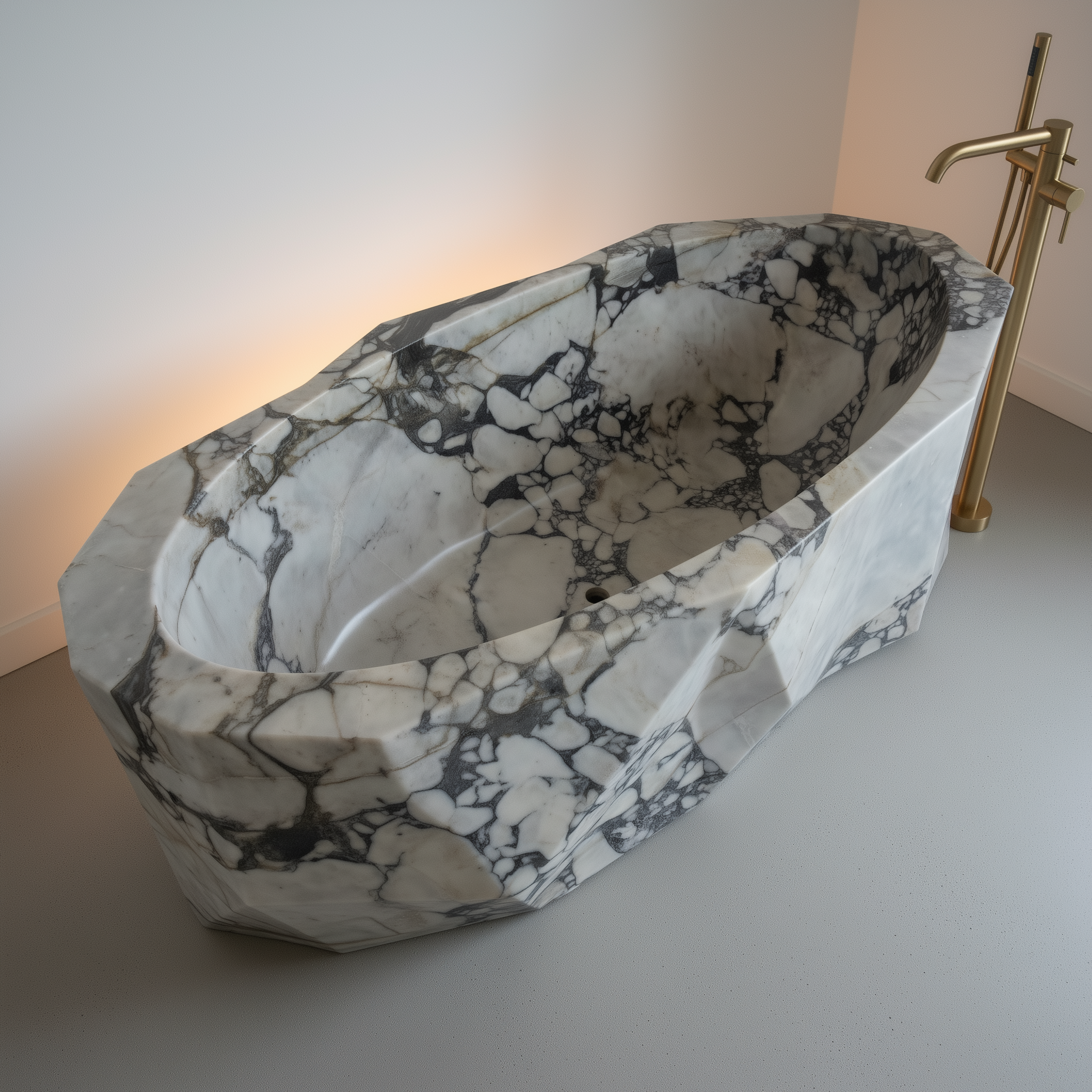 Marble-patterned freestanding bathtub with a gold faucet on a neutral background