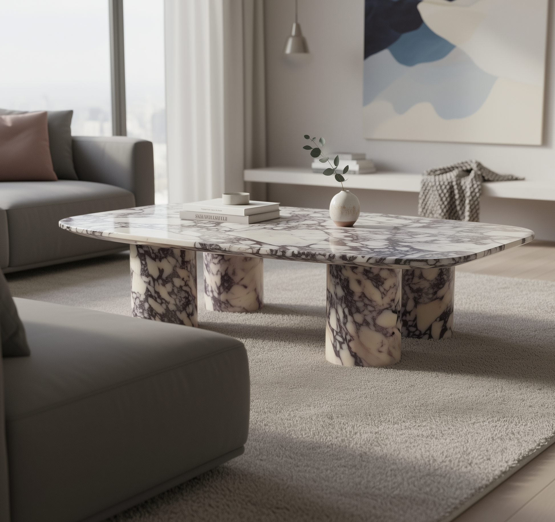 Calacatta Viola marble coffee table in a modern living room with gray sofa and abstract art on the wall.