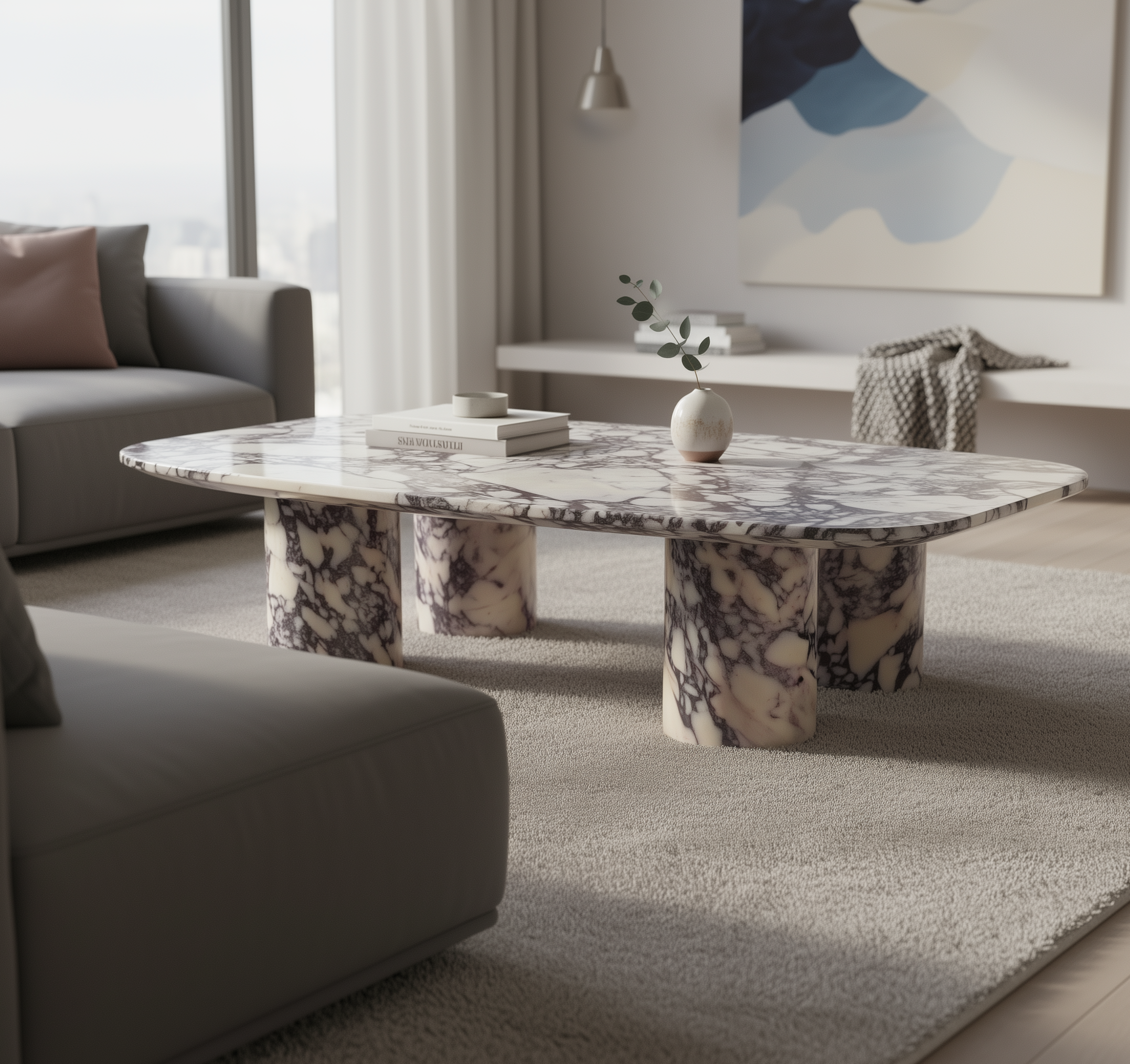 Calacatta Viola marble coffee table in a modern living room with gray sofa and abstract art on the wall.