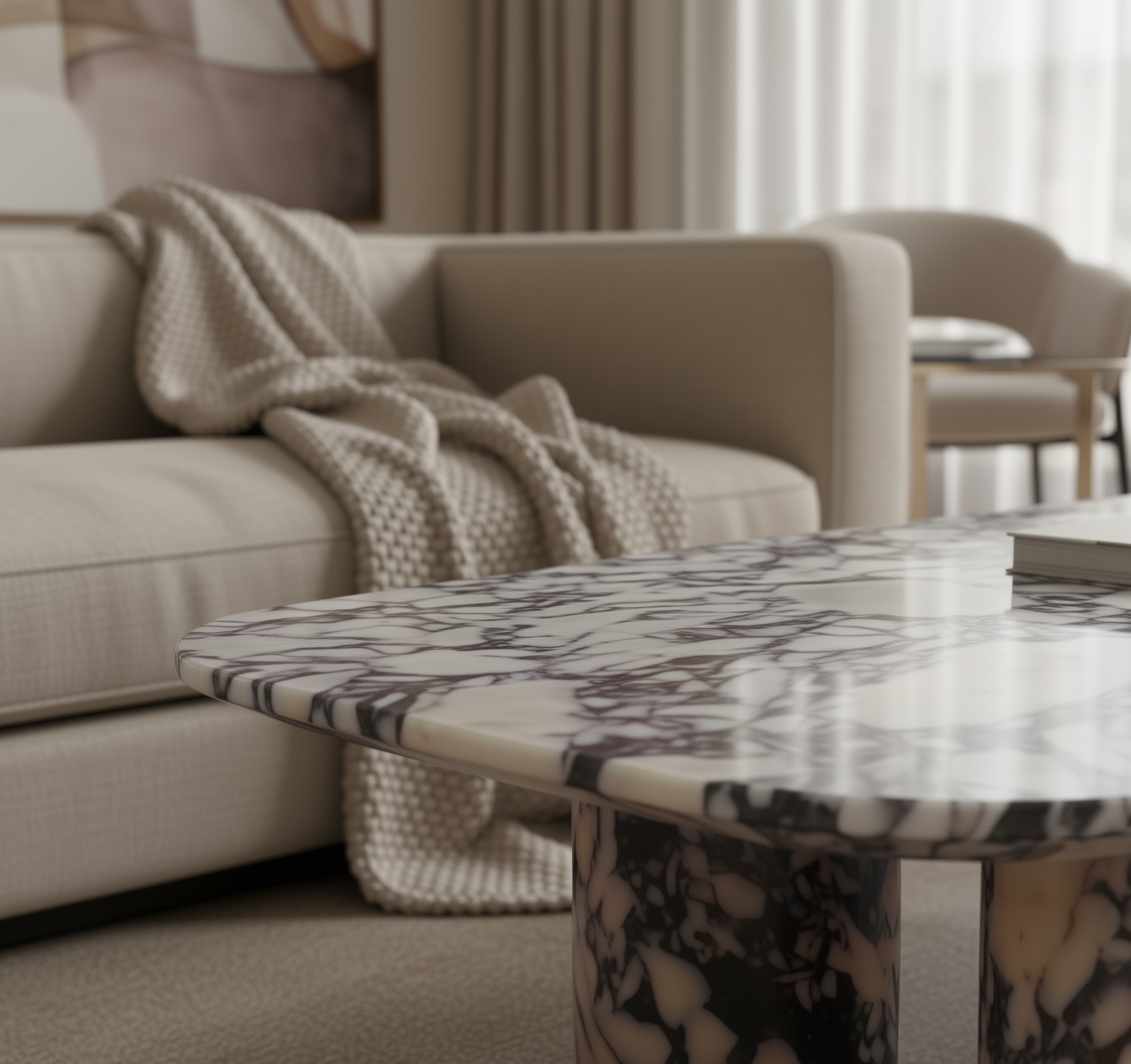 Marble-patterned coffee table in a living room setting with a beige sofa and decorative blanket.