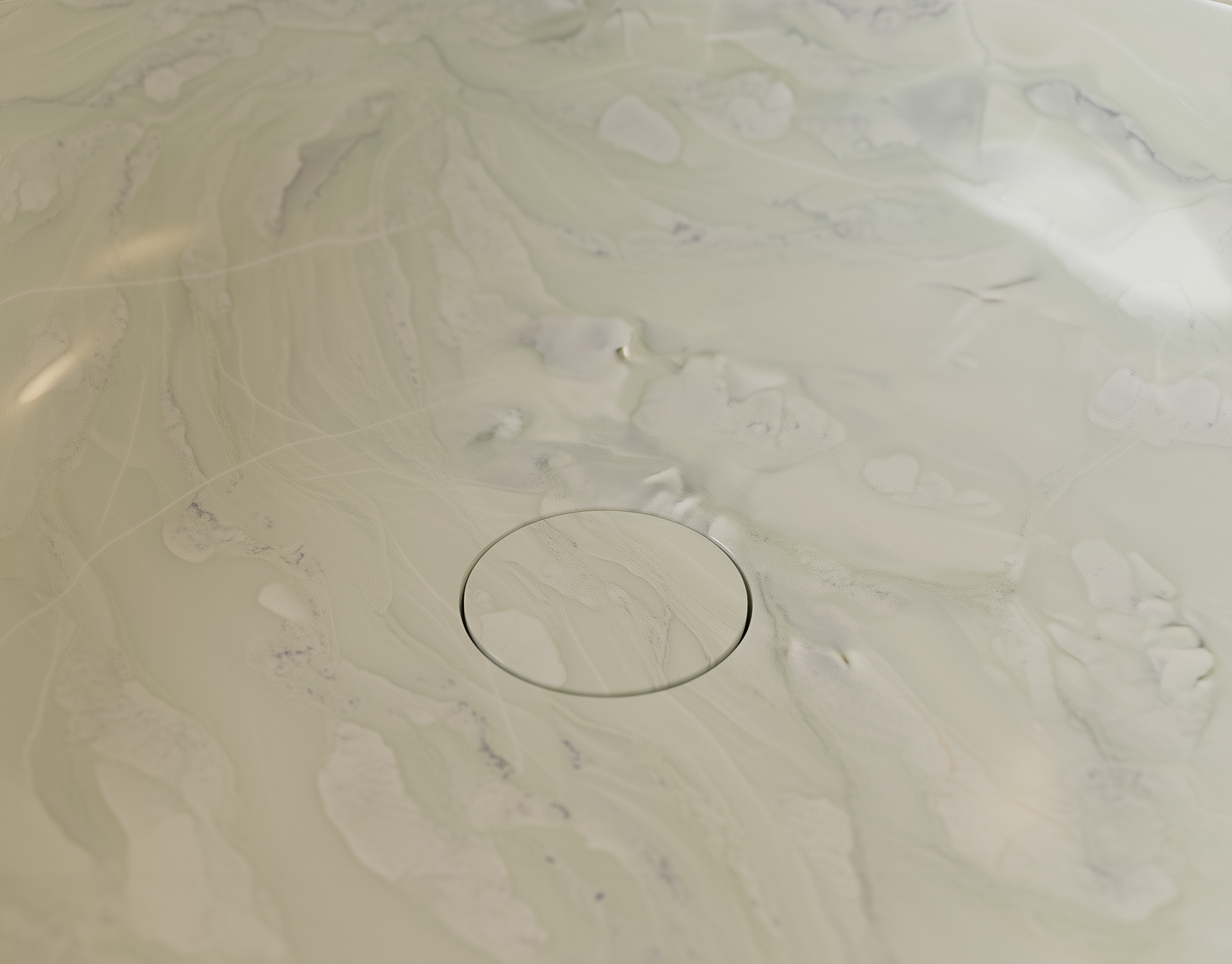 Marble-patterned surface with a circular drain hole