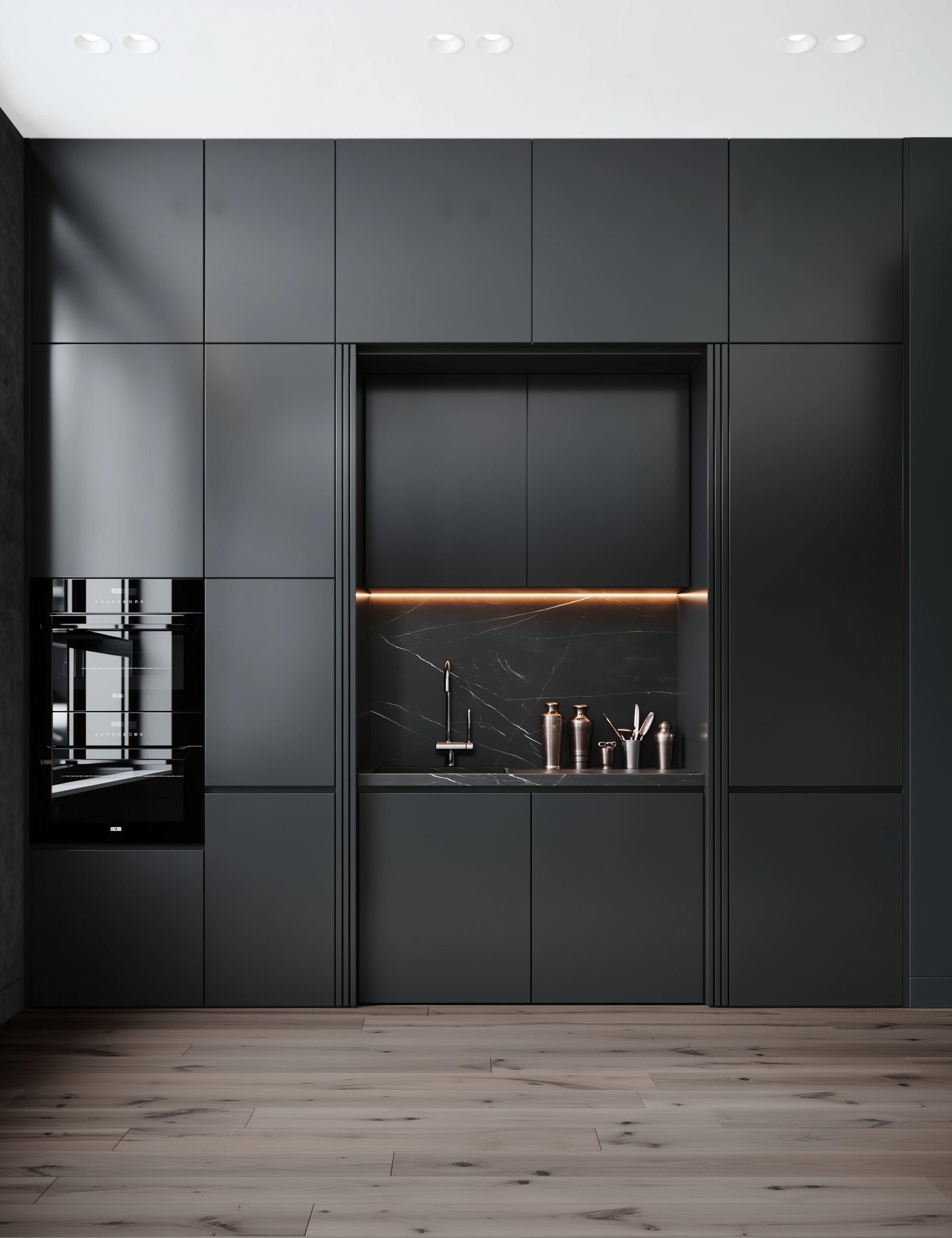 Modern kitchen with dark gray cabinets and a marble countertop.