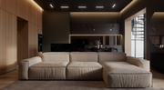 Modern living room with a beige sectional sofa and stylish decor.