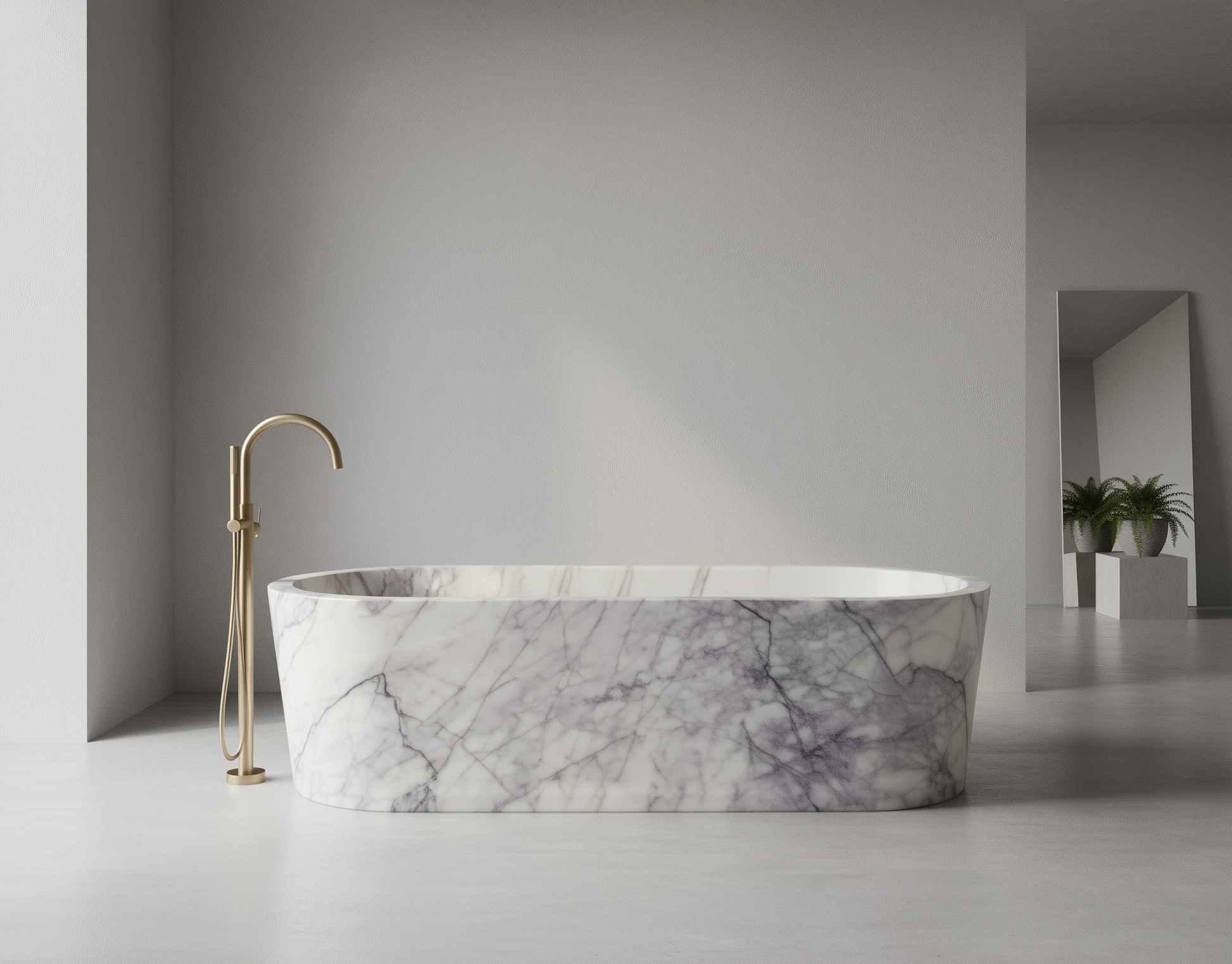 Marble-patterned freestanding bathtub with gold faucet in a minimalistic bathroom.