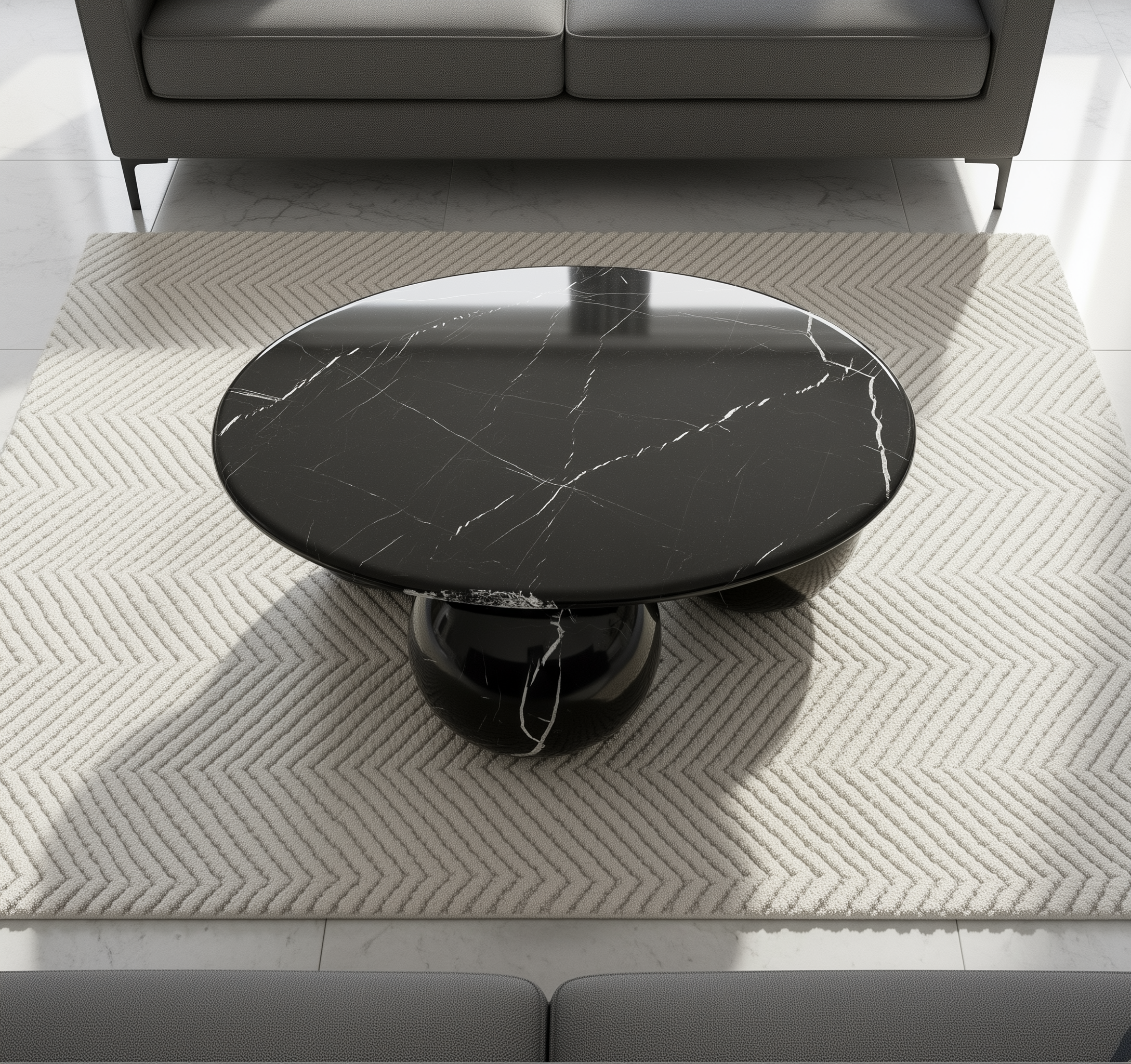 Round black marble coffee table on a textured rug with a gray sofa in the background