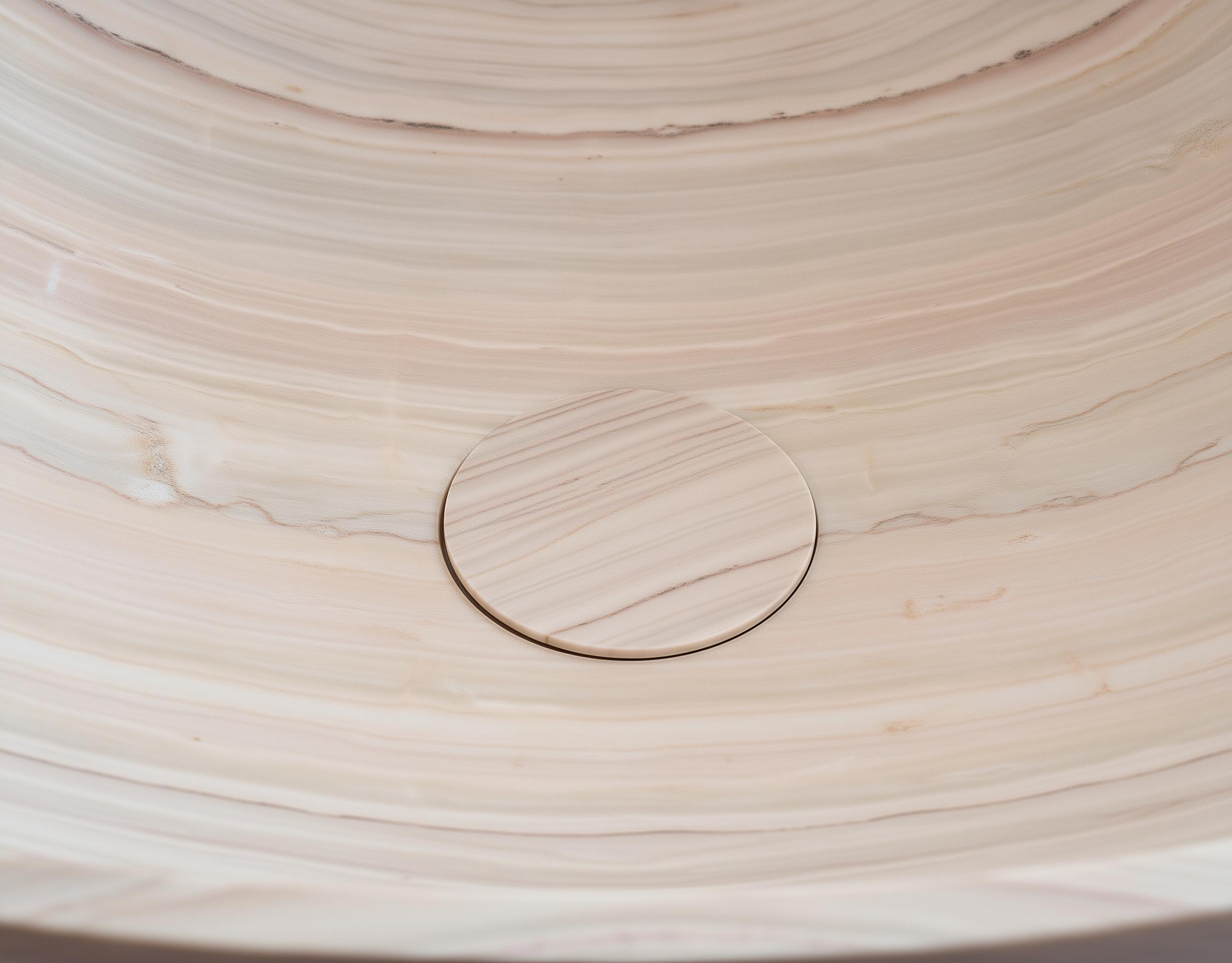 Close-up of a wooden surface with a circular cutout