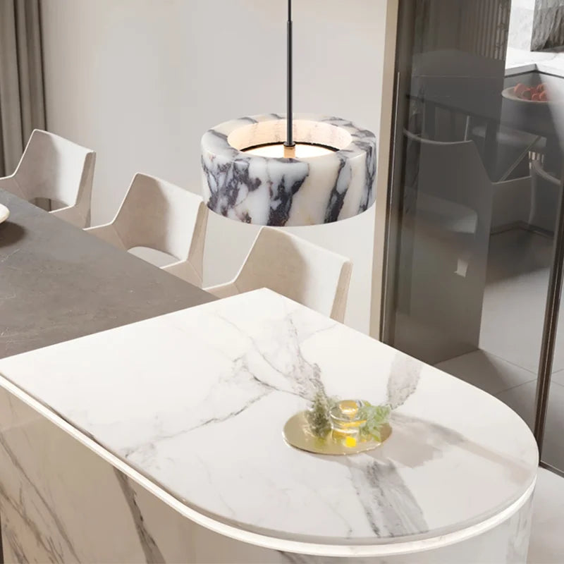 Modern dining room with marble table and pendant light