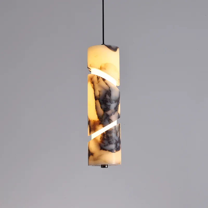 Pendant light with a cylindrical marble-like design on a gray background