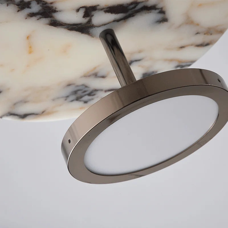 Metallic ring light with a marble background
