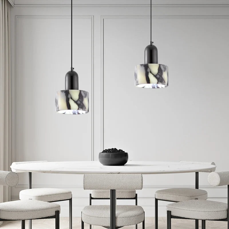 Modern dining room with marble table and pendant lights