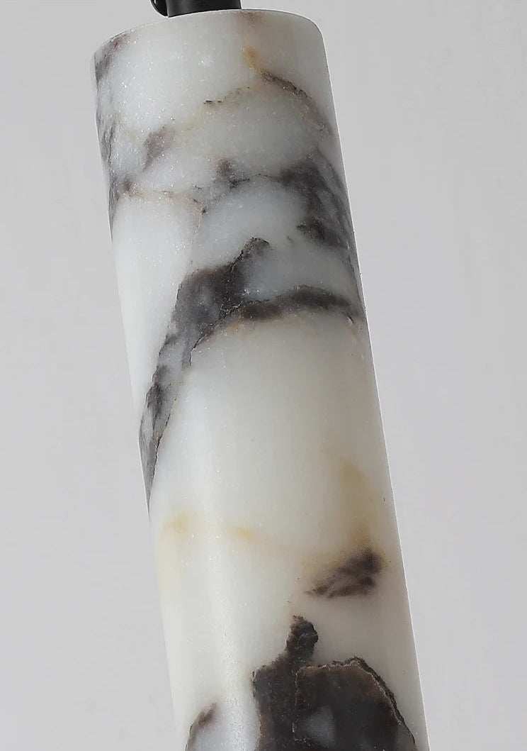 Marble-patterned cylindrical object on a white background