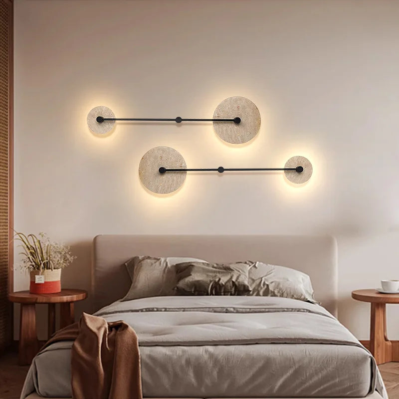 Modern wall lights above a bed in a bedroom setting