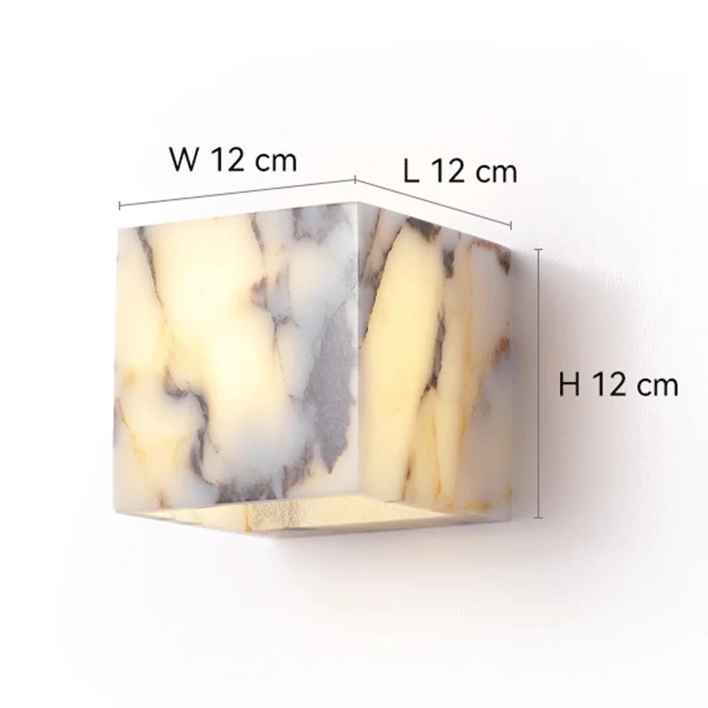 Marble-patterned wall light fixture with dimensions on a white background