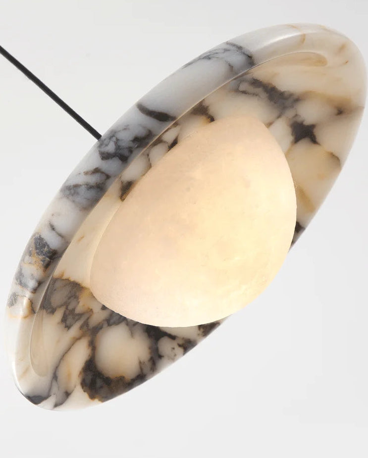 Marble-patterned pendant light on a white background