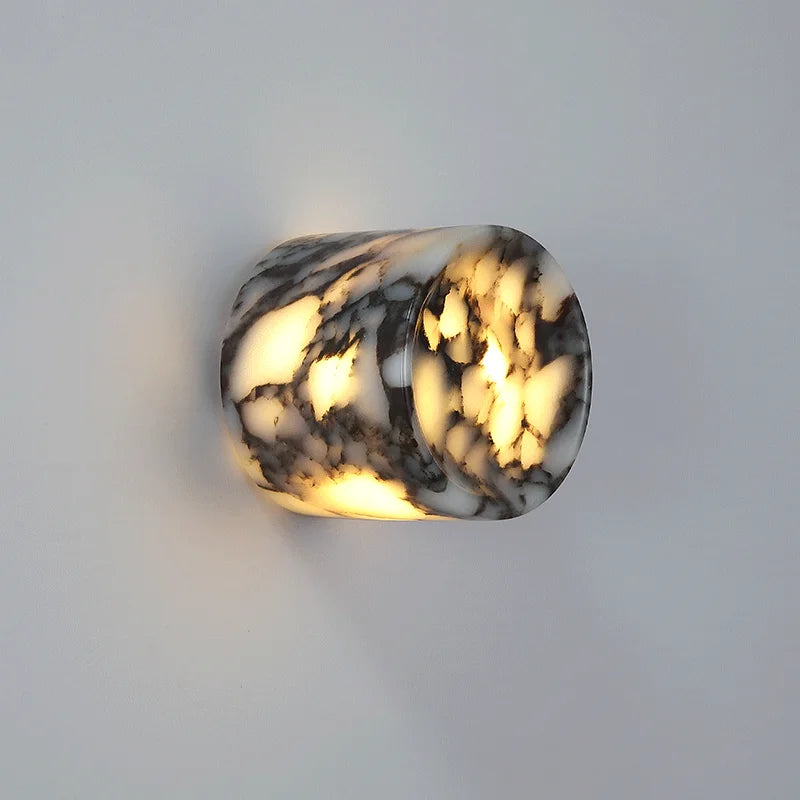 Marble-patterned wall light fixture on a plain background