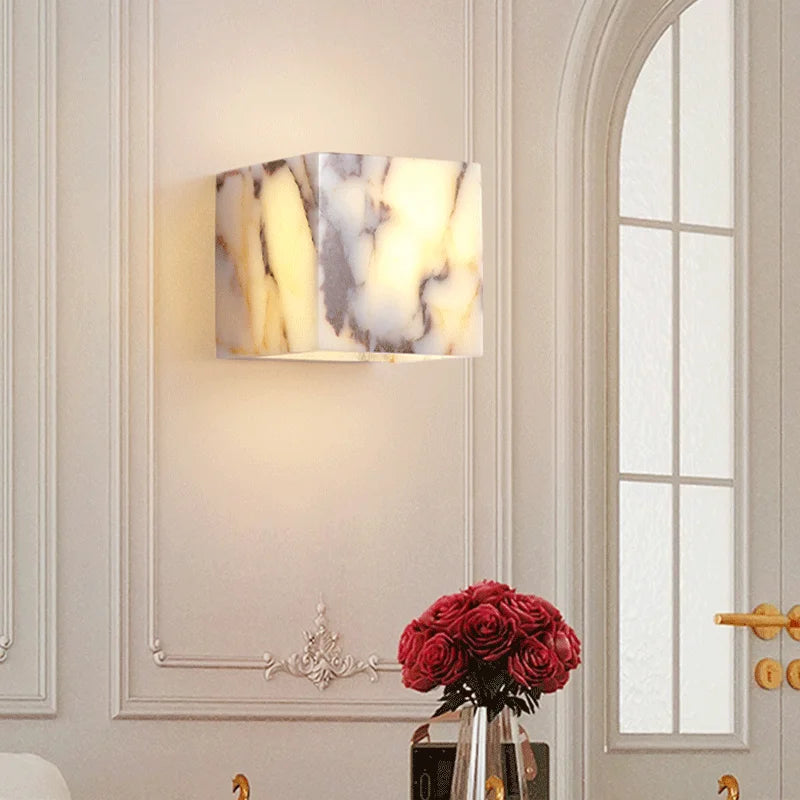 Decorative wall lamp with a marble pattern shade in a stylish interior setting.