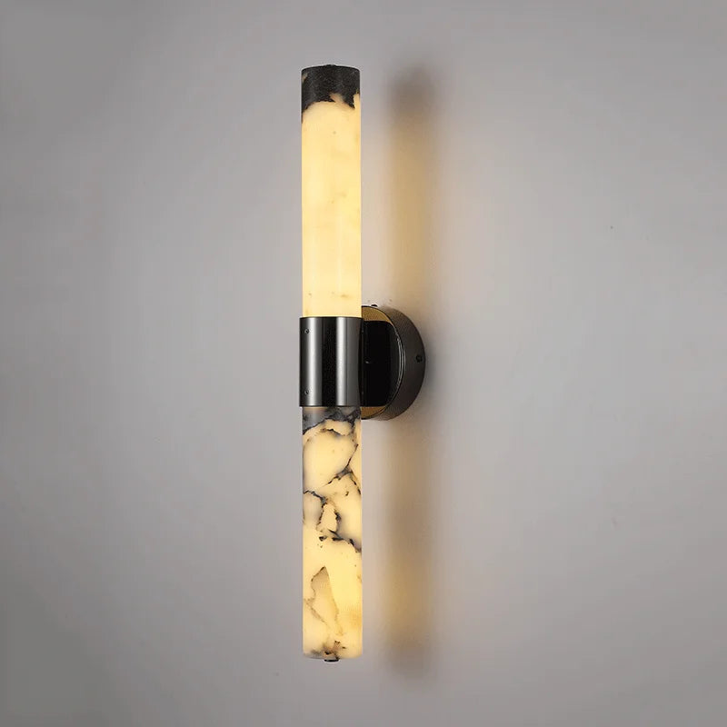 Wall-mounted light fixture with marble-like design on a gray background
