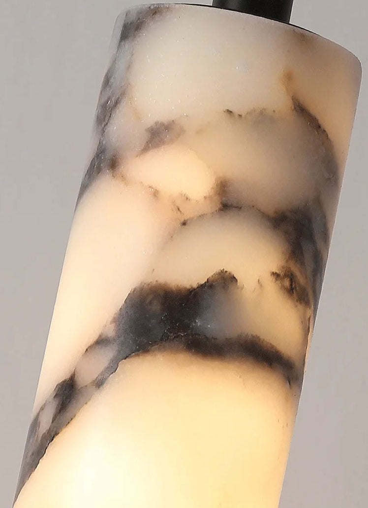 Marble-patterned cylindrical object on a gray background
