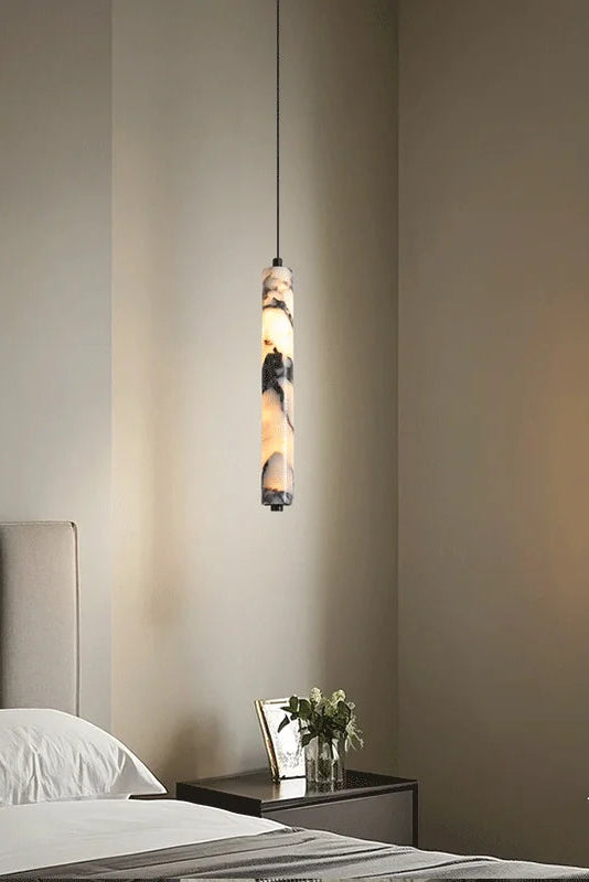 Siena marble slim pendant light natural stone cylinder hanging light with warm ambient glow
