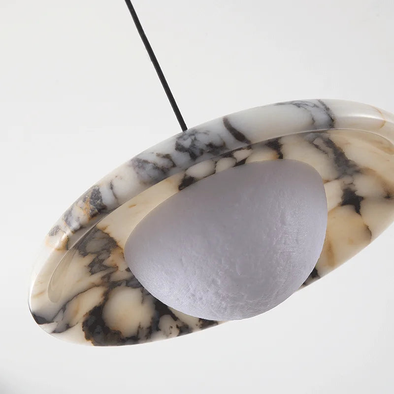 Marble-patterned pendant light with a gray shade on a white background
