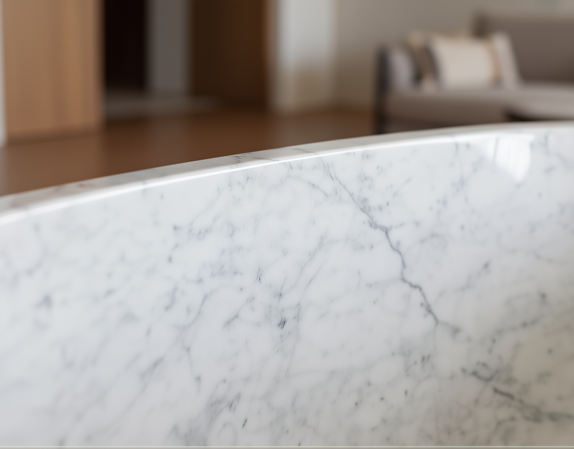 Close-up of a marble countertop with a blurred indoor setting in the background